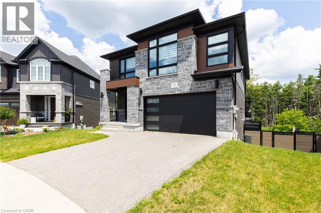 Contemporary exterior featuring stone veneer and dark siding accents - 71 Ian Ormston Drive, Waterloo, ON