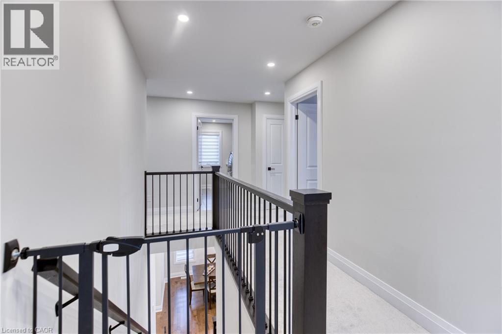 Upper-level hallway with carpeted flooring, recessed lighting, and white walls - 71 Ian Ormston Drive, Kitchener, ON - Indoor Photo Showing Other Room