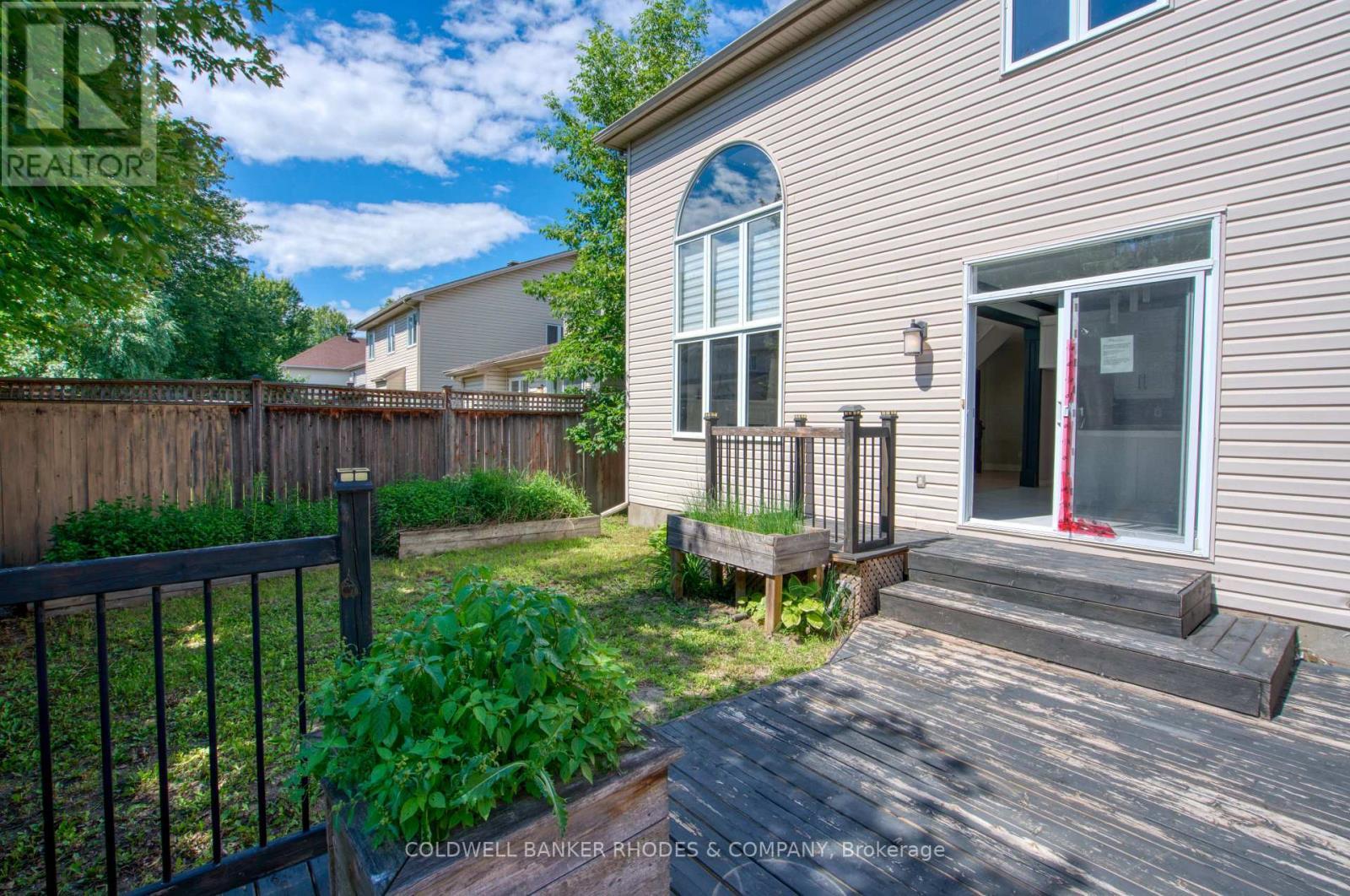 Private backyard with deck. - 32 Catterick Crescent, Ottawa, ON
