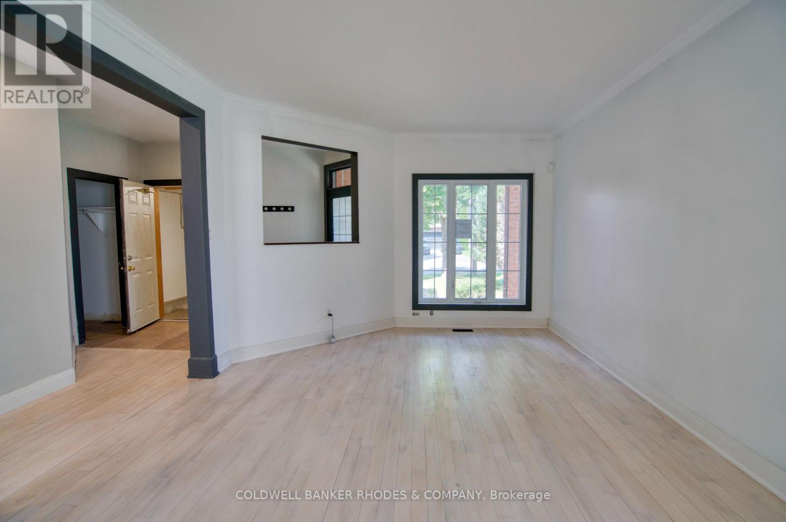 Living room with front windows street view - 32 Catterick Crescent, Ottawa, ON