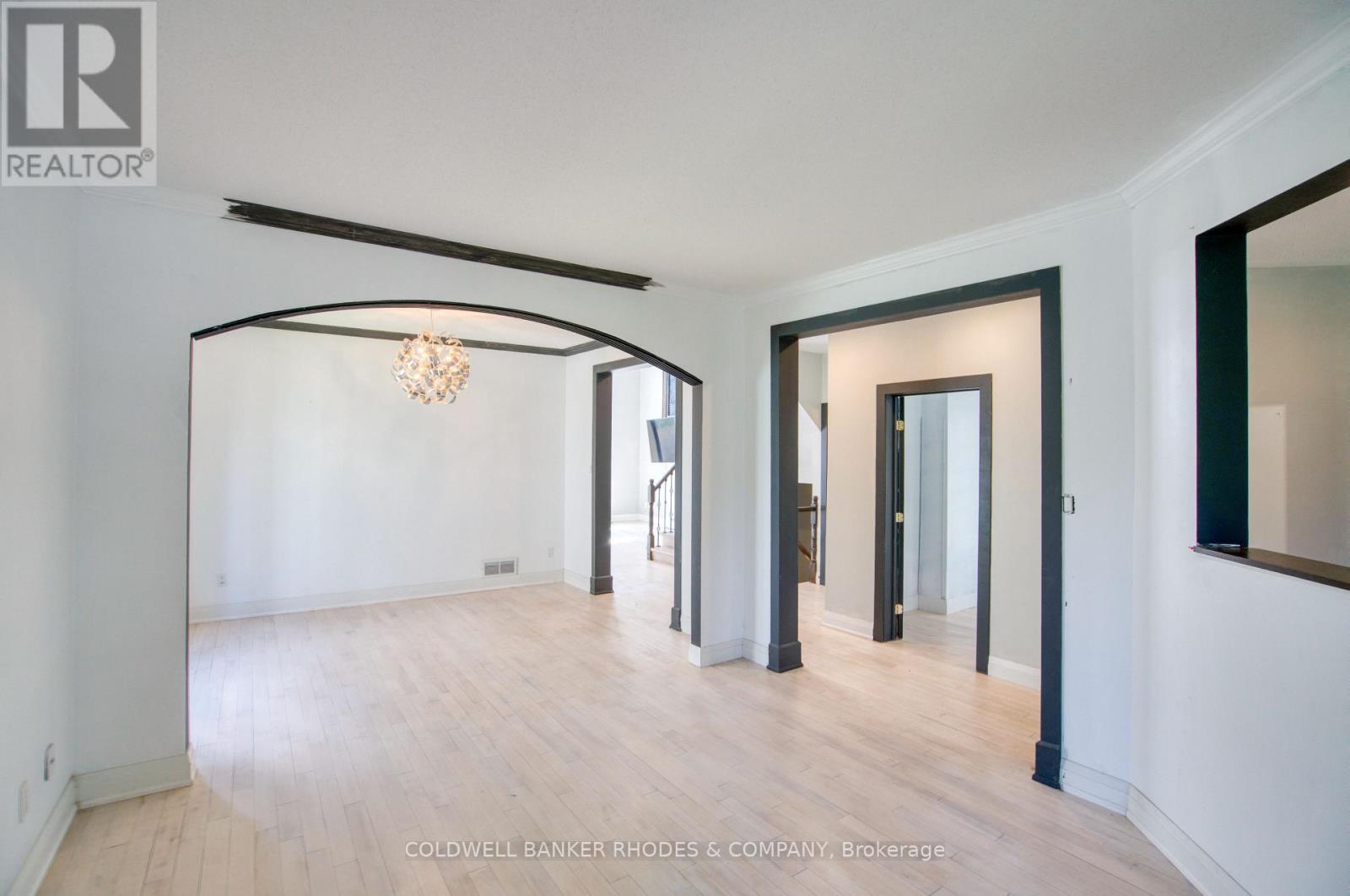 Living room looking into dining room. - 32 Catterick Crescent, Ottawa, ON