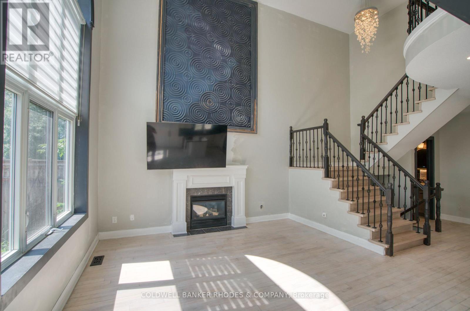 Family room is two stories and open to above. - 32 Catterick Crescent, Ottawa, ON