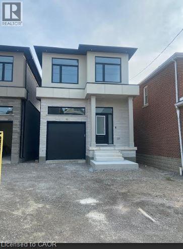 Modern two-story facade featuring light-toned brick and stucco finishes - 48 Melbourne Street, Hamilton, ON - Outdoor With Facade