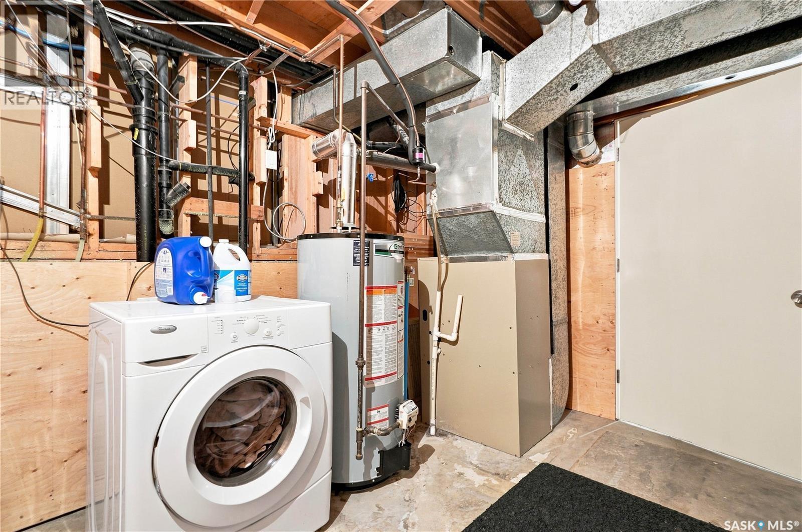 242 Candle Crescent, Saskatoon, SK - Indoor Photo Showing Laundry Room