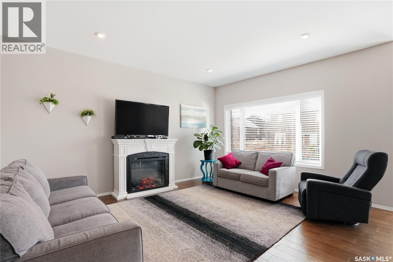 983 Pringle Cove, Saskatoon, SK - Indoor Photo Showing Living Room With Fireplace