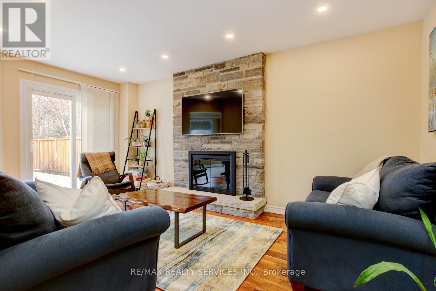 28 Chickadee Crescent, Brampton, ON - Indoor Photo Showing Living Room With Fireplace