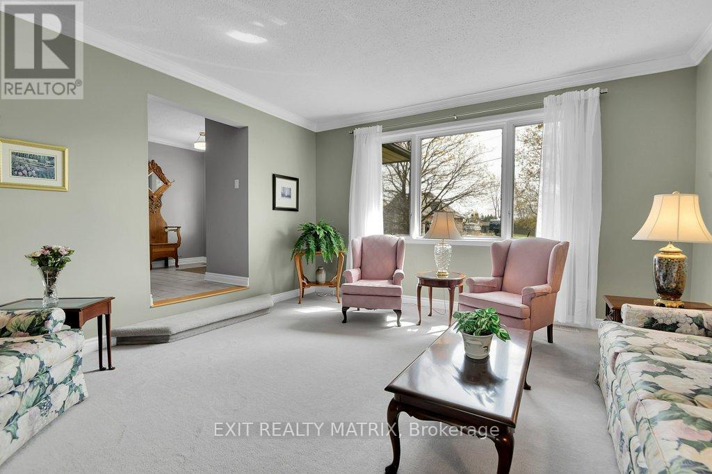 Large living room with a huge window. - 1340 Cuthbert Way, Ottawa, ON - Indoor Photo Showing Living Room