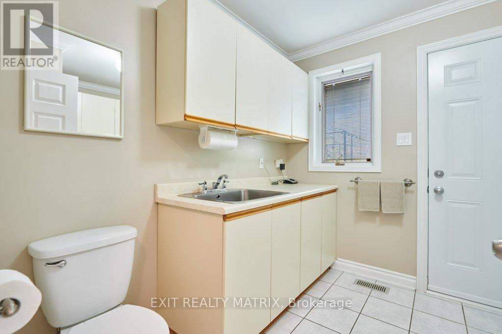Laundry room/2nd main floor powder room. - 1340 Cuthbert Way, Ottawa, ON - Indoor Photo Showing Bathroom