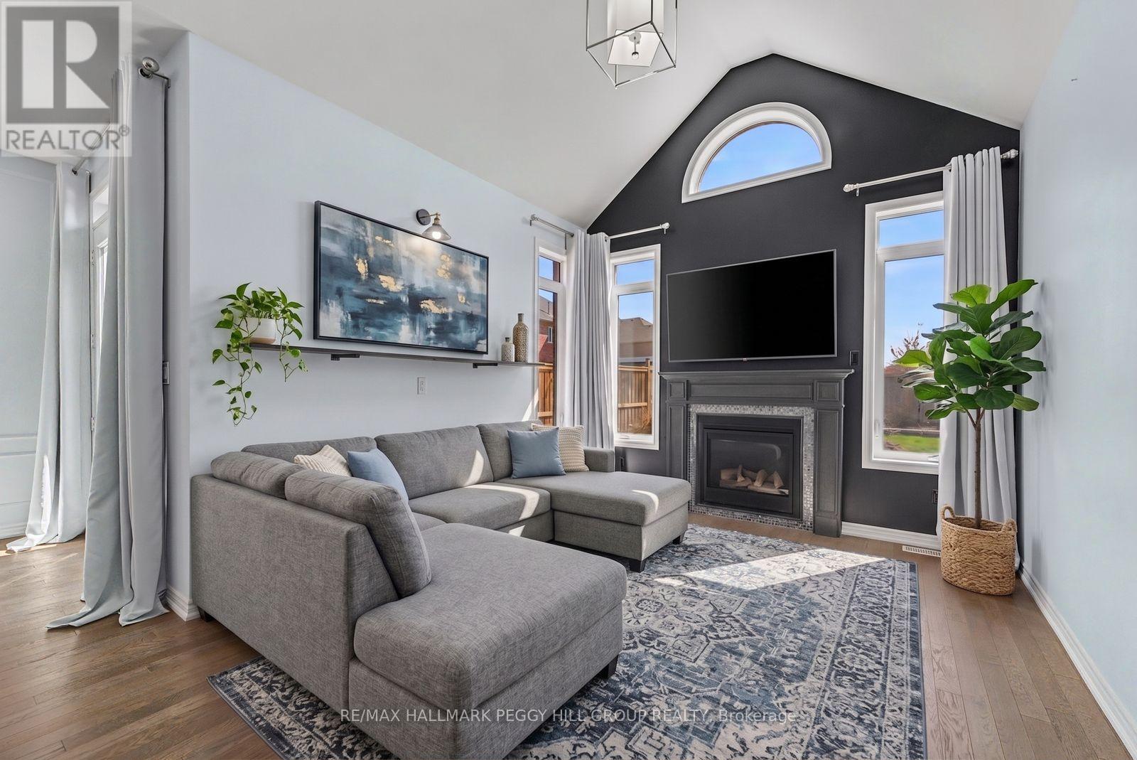 96 Redmond Crescent, Springwater, ON - Indoor Photo Showing Living Room With Fireplace