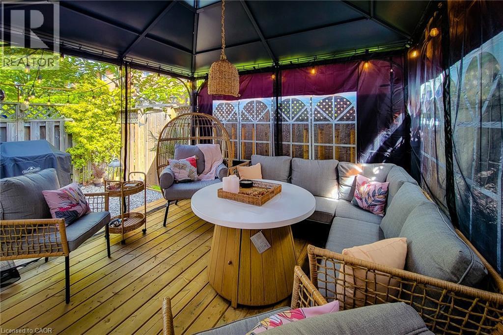 Outdoor covered deck featuring wood plank flooring and an enclosed gazebo structure - 7 Davidson Boulevard Unit# 14, Dundas, ON - Outdoor With Deck Patio Veranda With Exterior