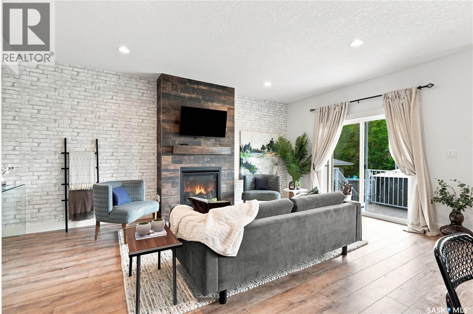 158 3220 11Th Street W, Saskatoon, SK - Indoor Photo Showing Living Room With Fireplace