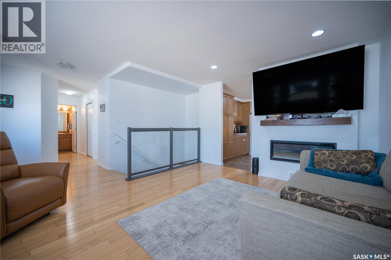 117 Good Spirit Crescent, Yorkton, SK - Indoor Photo Showing Living Room With Fireplace