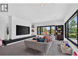 Custom-built fireplace mantel designed to accommodate an 85-inch TV, creating the perfect focal point for movie nights and entertaining. -