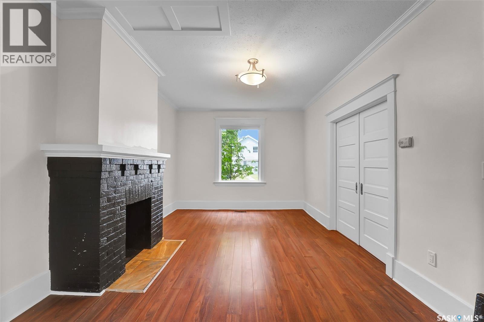 736 7Th Avenue N, Saskatoon, SK - Indoor Photo Showing Other Room With Fireplace
