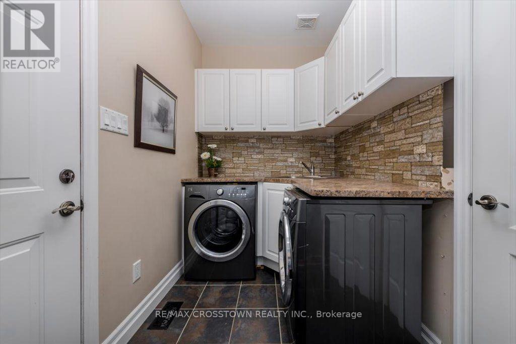 Main floor laundry / mudroom - 5 Pine Hill Drive, Springwater, ON - Indoor Photo Showing Laundry Room