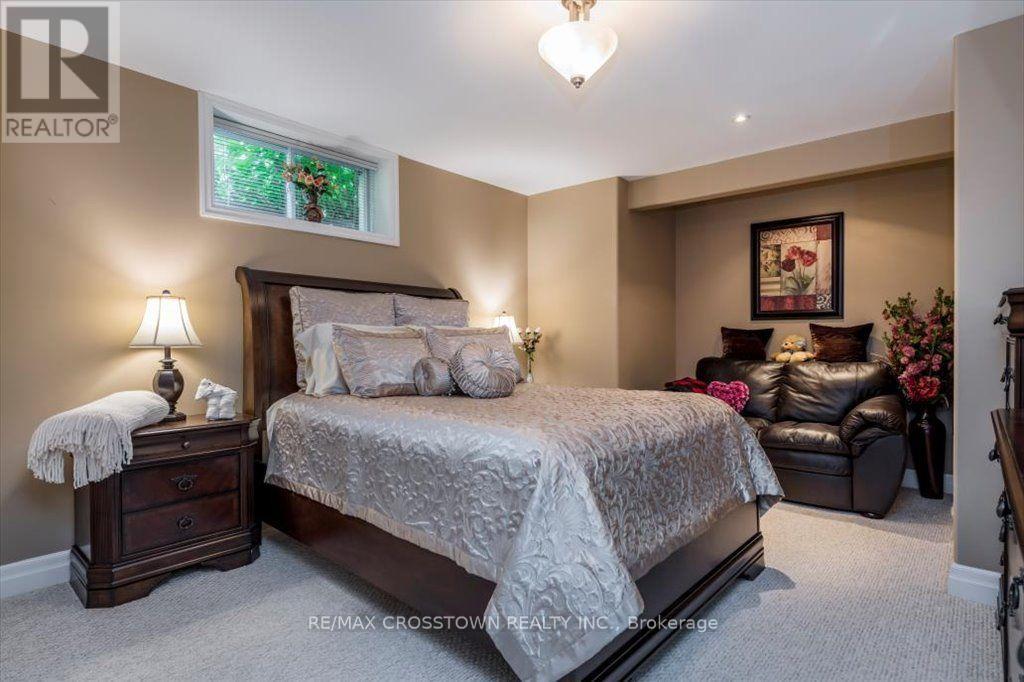 Guest suite with sitting area - 5 Pine Hill Drive, Springwater, ON - Indoor Photo Showing Bedroom