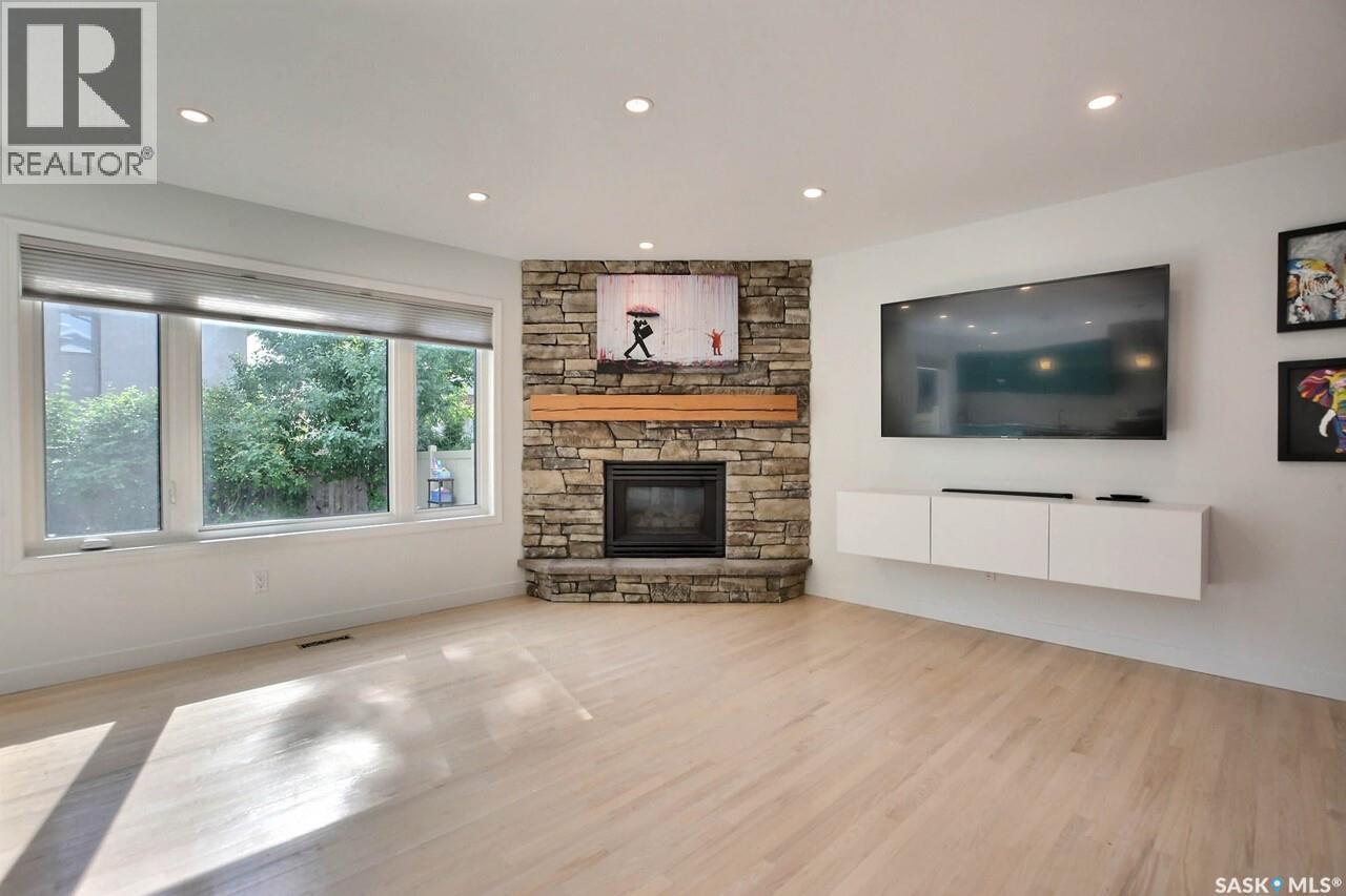 3544 Basswood Grove, Regina, SK - Indoor Photo Showing Living Room With Fireplace