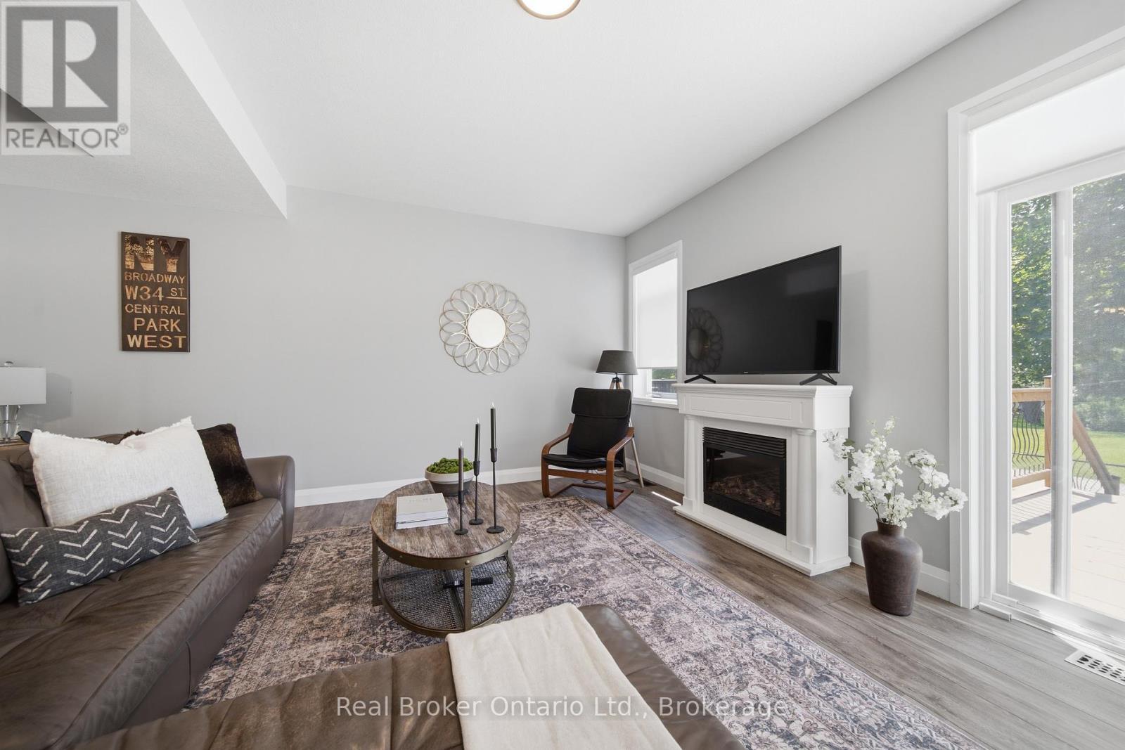 103 Stephenson Way, Minto, ON - Indoor Photo Showing Living Room With Fireplace