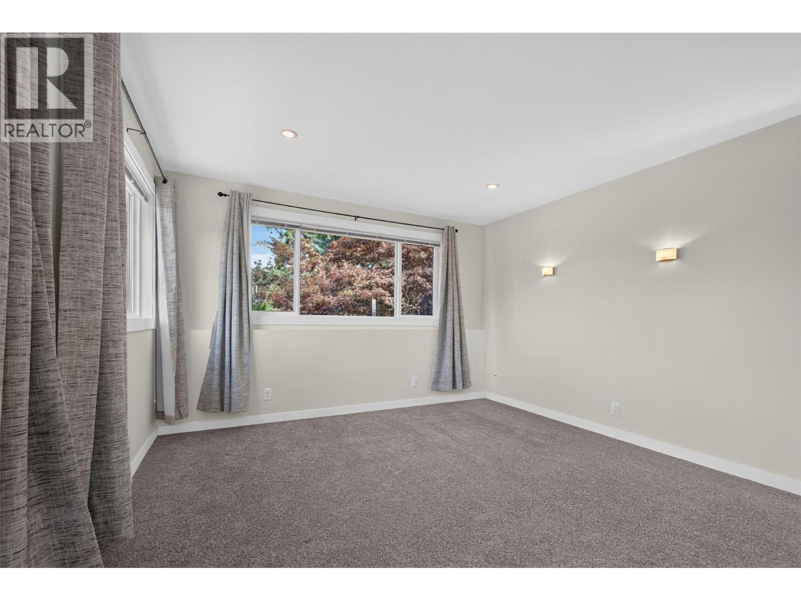 **Virtually Staged** suite bedroom 2 - 2220 Thacker Drive, West Kelowna, BC - Indoor Photo Showing Bedroom