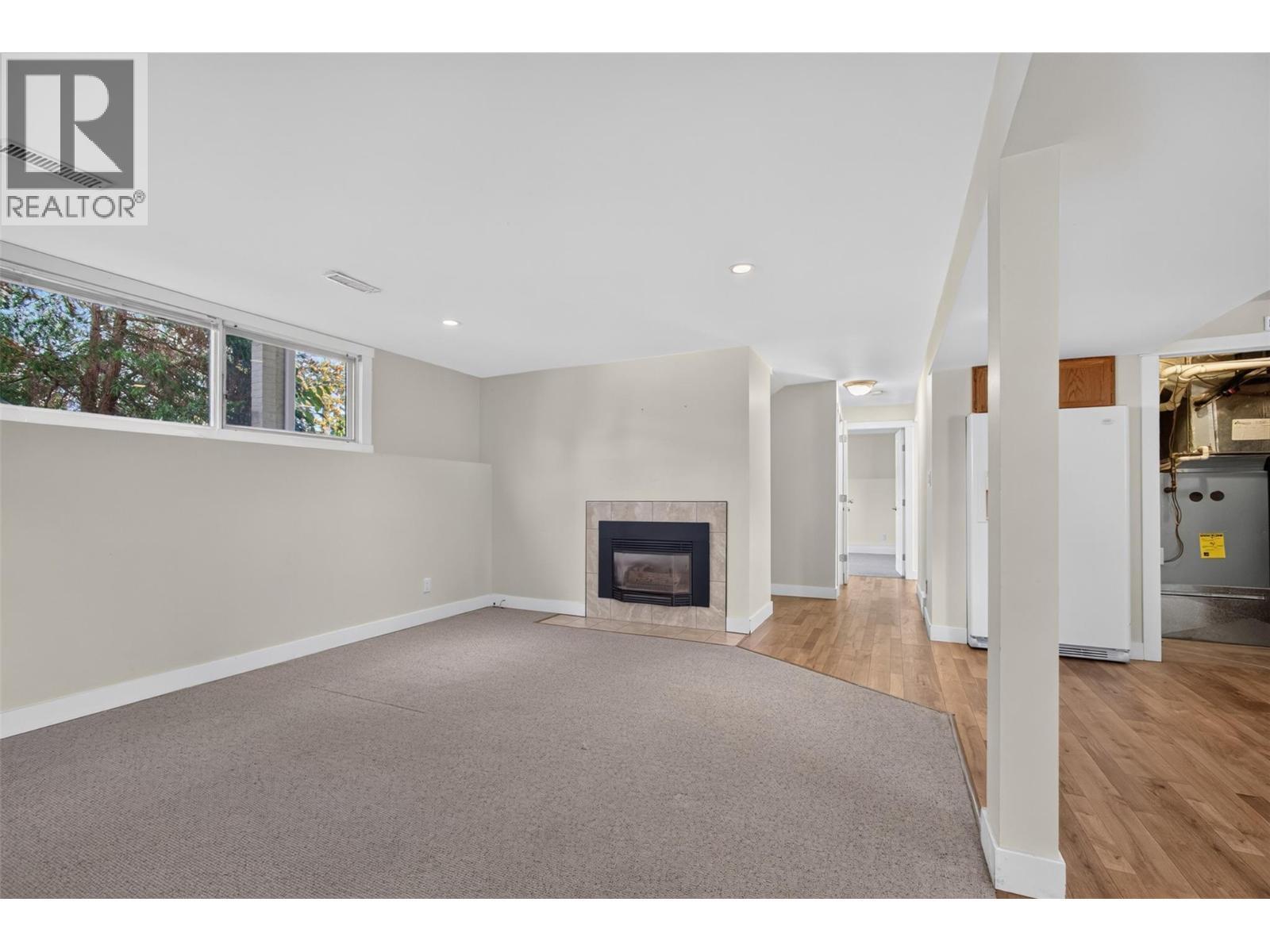 suite living - 2220 Thacker Drive, West Kelowna, BC - Indoor With Fireplace