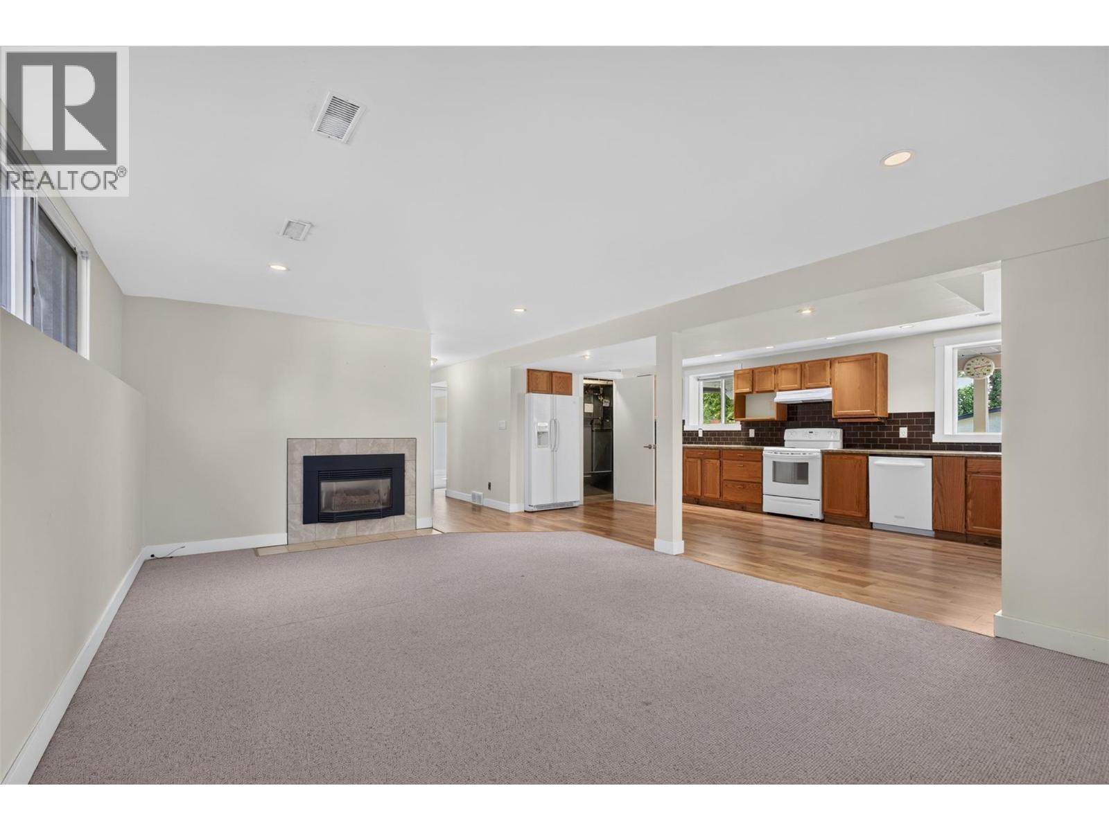 suite living - 2220 Thacker Drive, West Kelowna, BC - Indoor With Fireplace