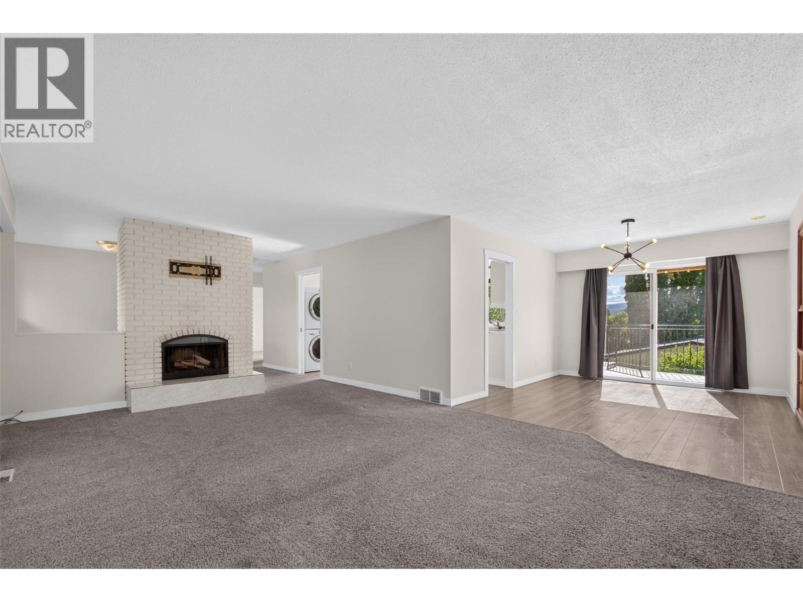 **Virtually Staged** main living - 2220 Thacker Drive, West Kelowna, BC - Indoor Photo Showing Living Room With Fireplace