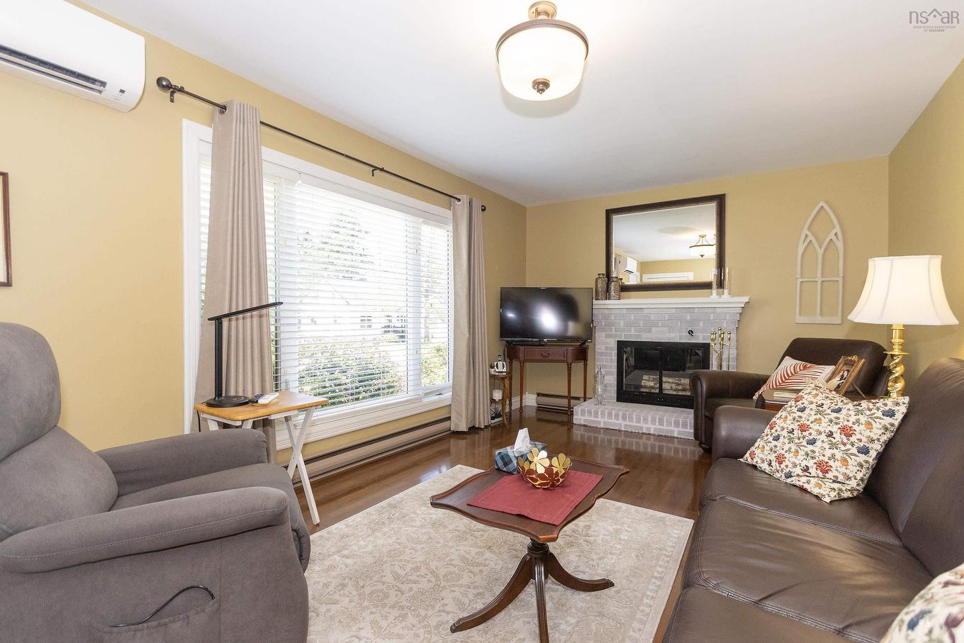 12 Central Avenue, Amherst, NS - Indoor Photo Showing Living Room With Fireplace