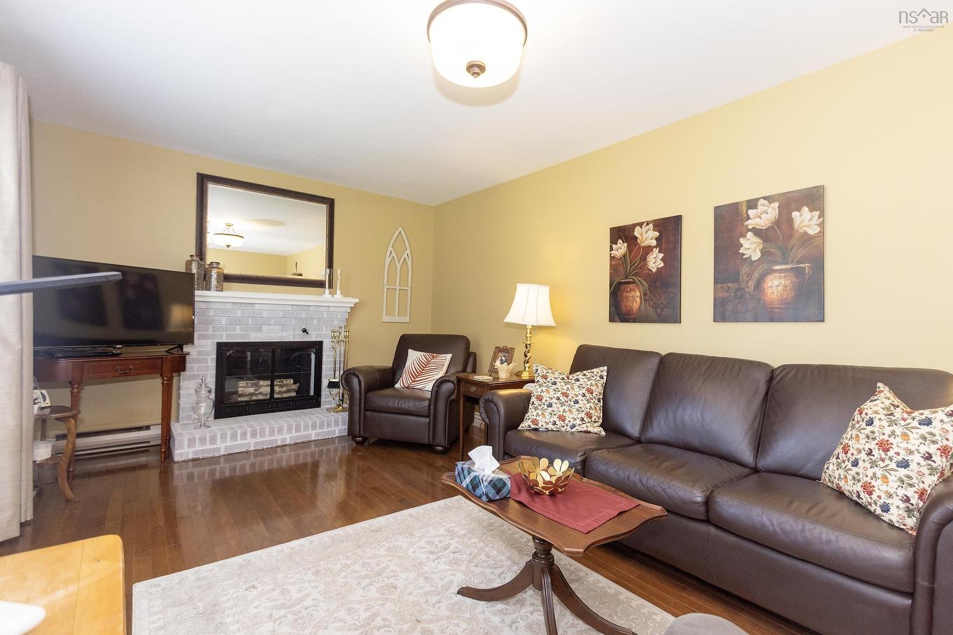 12 Central Avenue, Amherst, NS - Indoor Photo Showing Living Room With Fireplace