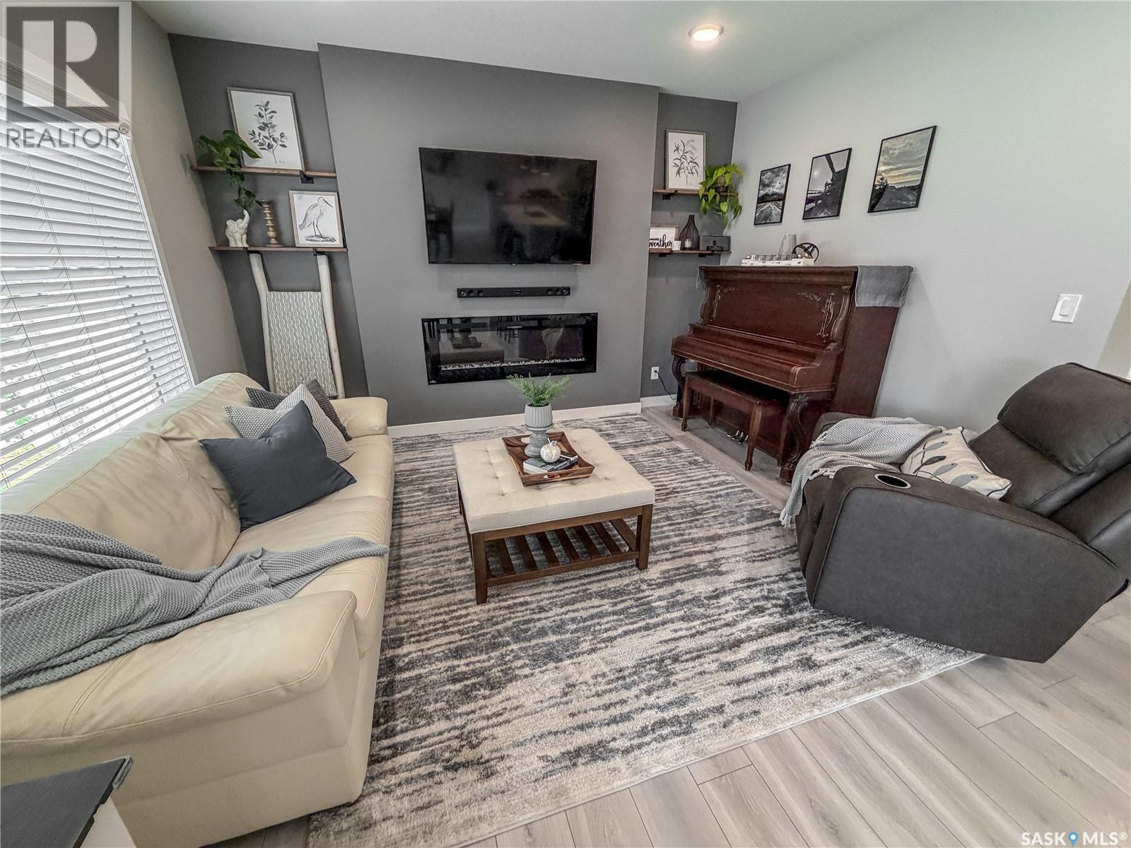 3755 Gee Crescent, Regina, SK - Indoor Photo Showing Living Room With Fireplace