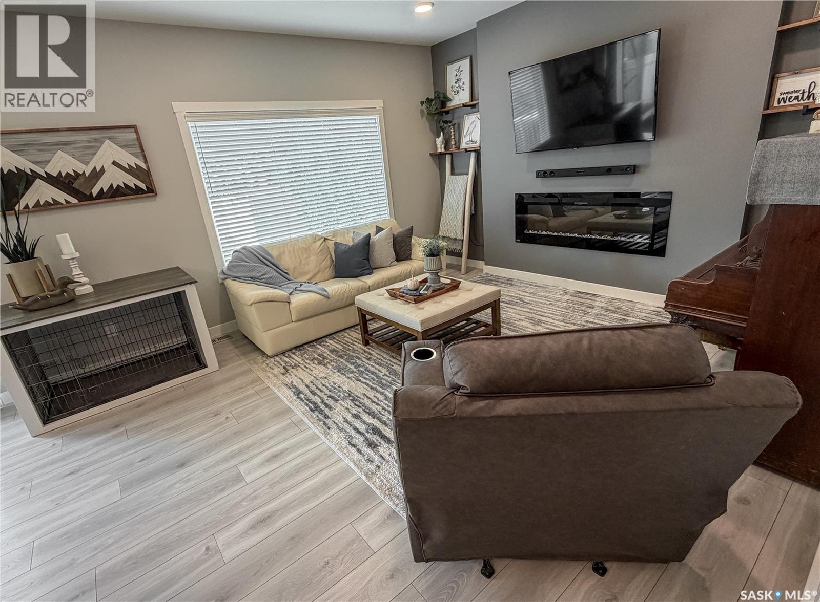 3755 Gee Crescent, Regina, SK - Indoor Photo Showing Living Room With Fireplace