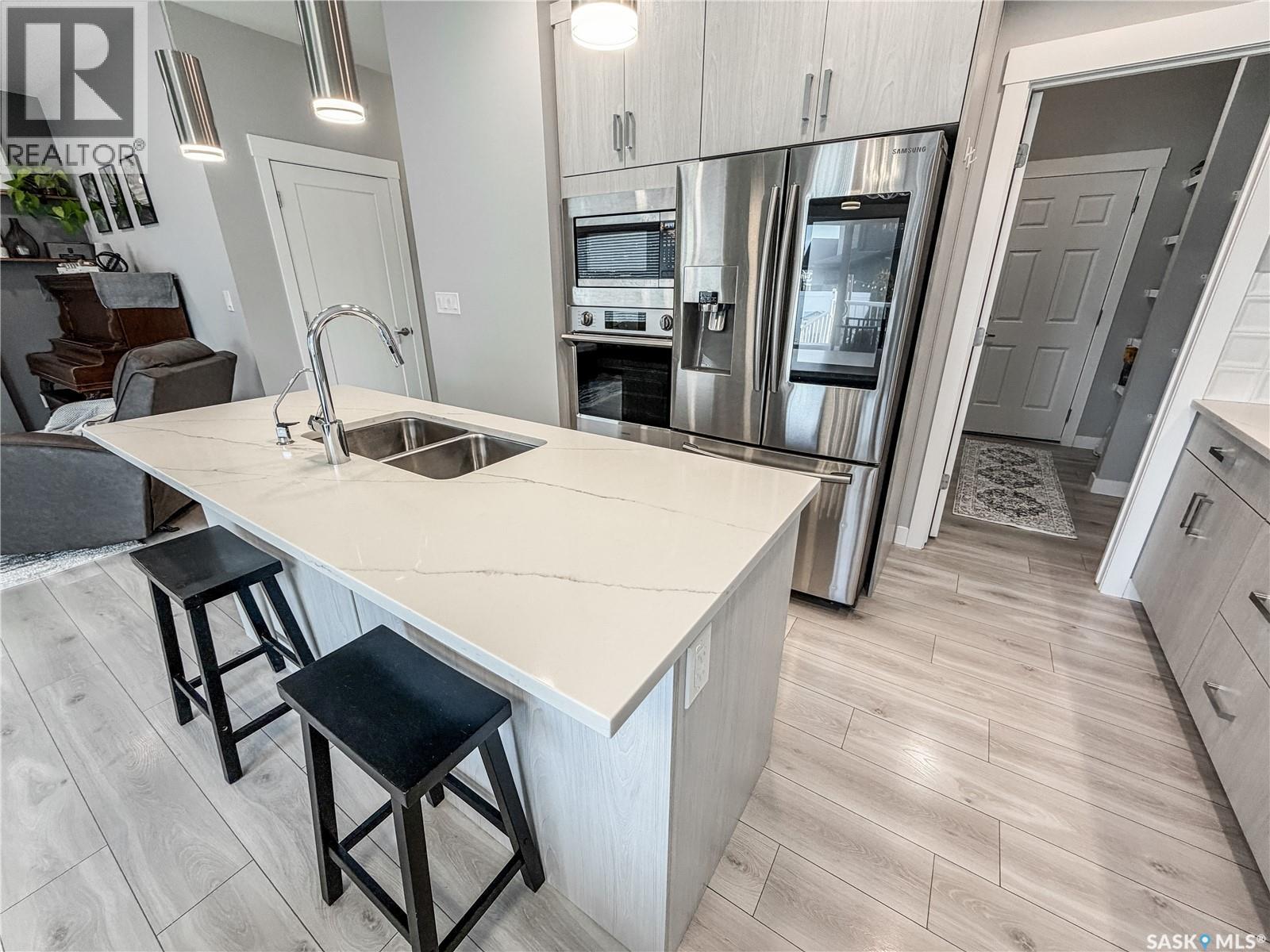 3755 Gee Crescent, Regina, SK - Indoor Photo Showing Kitchen With Stainless Steel Kitchen With Double Sink With Upgraded Kitchen