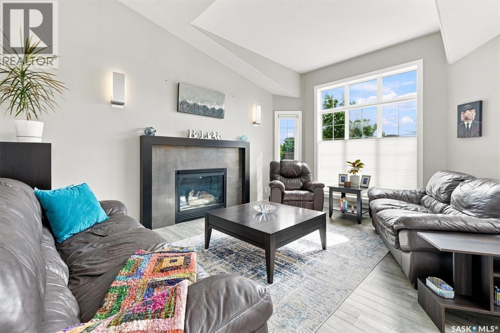 547 Bayview Terrace, Saskatoon, SK - Indoor Photo Showing Living Room With Fireplace