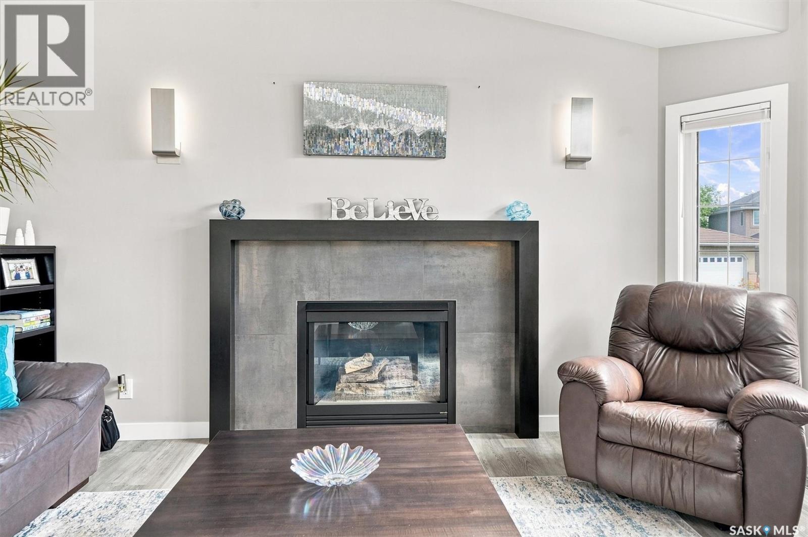 547 Bayview Terrace, Saskatoon, SK - Indoor Photo Showing Living Room With Fireplace
