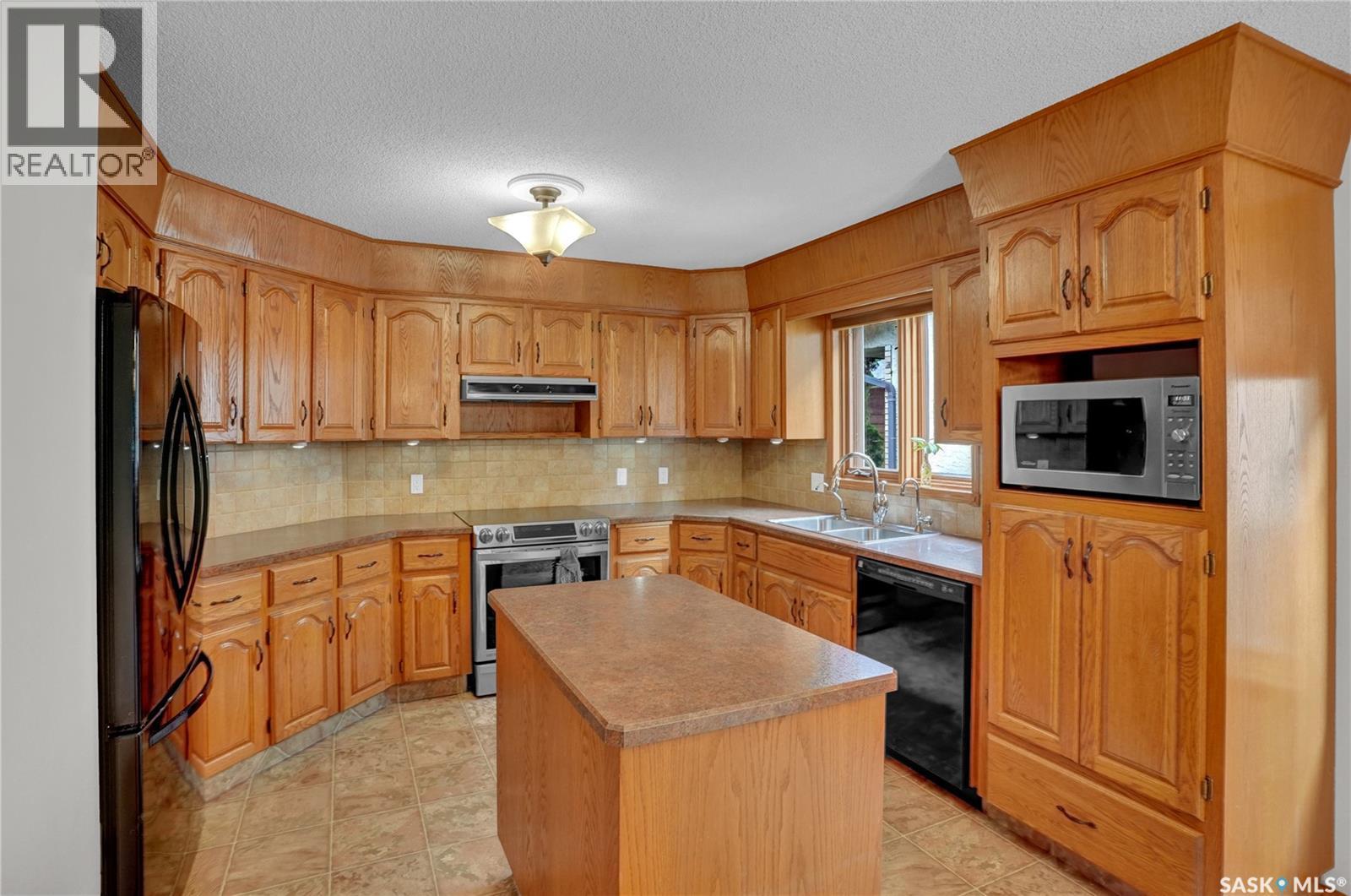3474 Olive Grove, Regina, SK - Indoor Photo Showing Kitchen With Double Sink