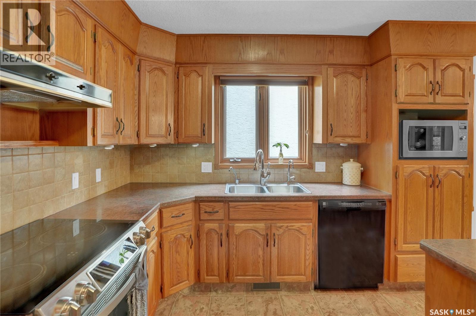 3474 Olive Grove, Regina, SK - Indoor Photo Showing Kitchen With Double Sink