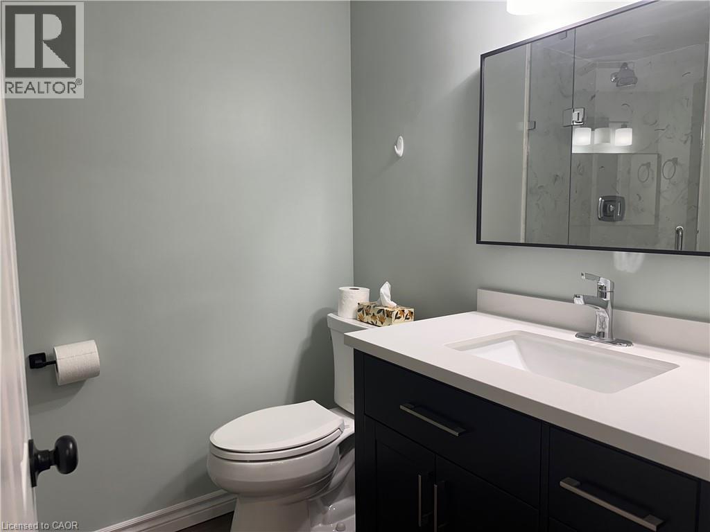 Vanity featuring a white countertop with an integrated sink and chrome faucet - 4187 Weimar Line, Wellesley, ON - Indoor Photo Showing Bathroom