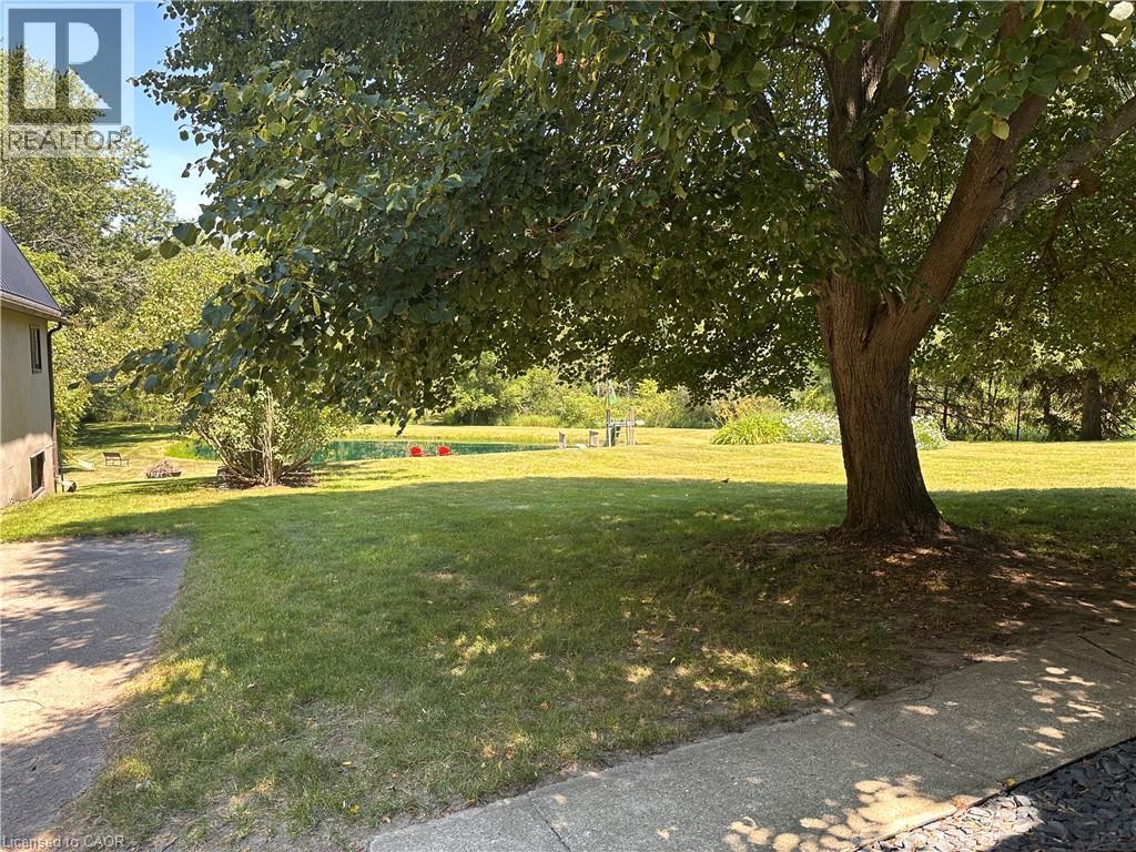 Expansive grassy yard featuring mature trees and established perimeter foliage - 4187 Weimar Line, Wellesley, ON - Outdoor