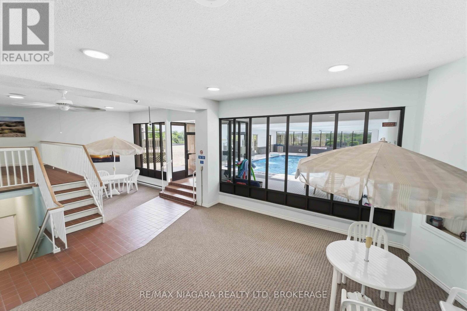 indoor seating area around pool - 1207 - 7 Gale Crescent, St. Catharines (E. Chester), ON - Indoor Photo Showing Bedroom