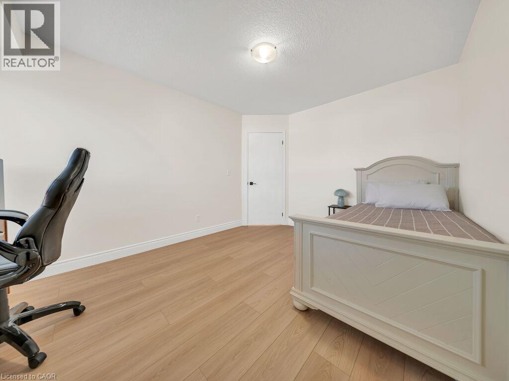 Room featuring light wood-finish flooring and white baseboards - 39 Baintree Way, Cambridge, ON - Indoor