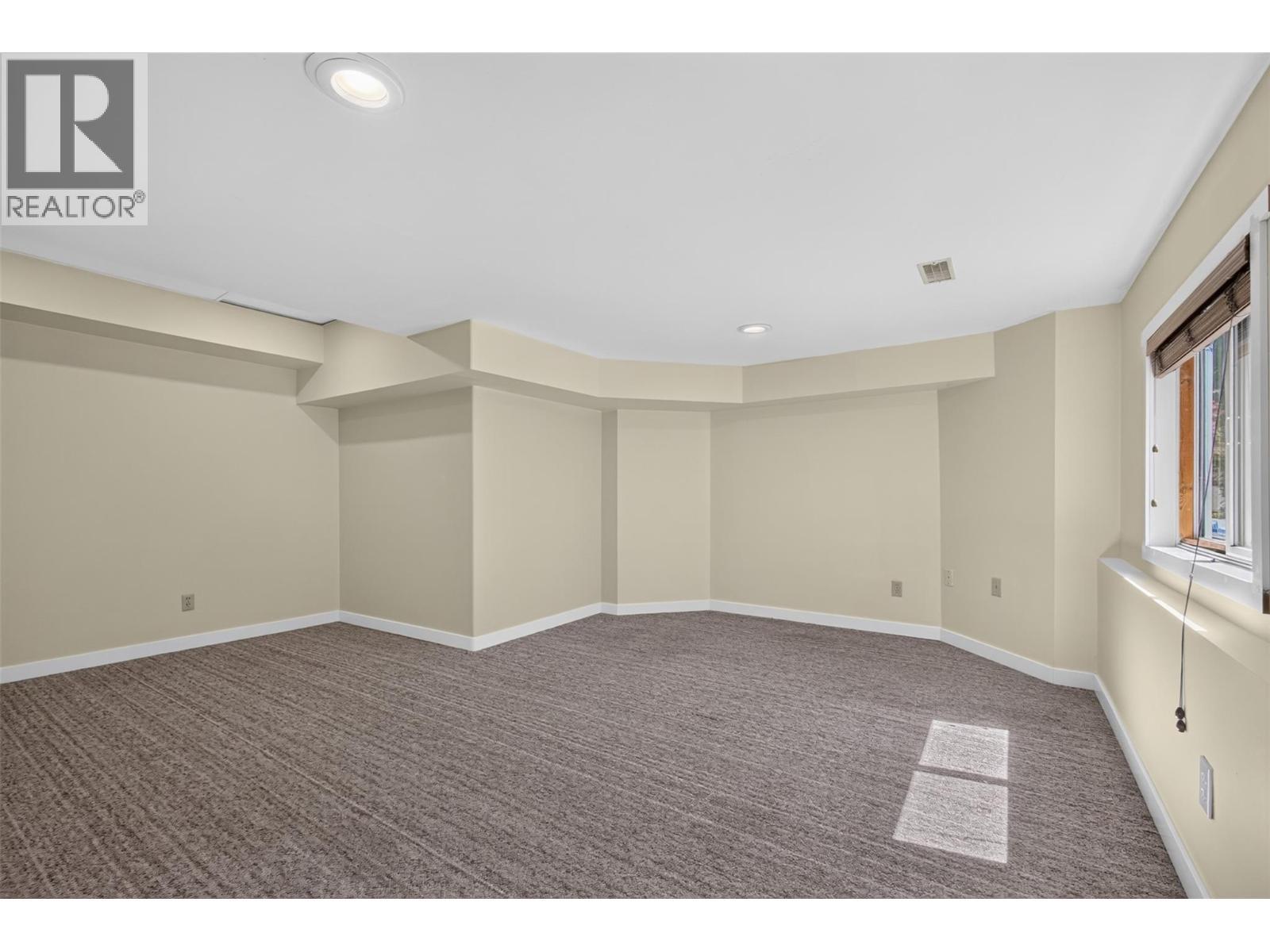 5th bedroom/ Recreation room with separate entrance - 602 Glenmeadows Road, Kelowna, BC - Indoor Photo Showing Other Room