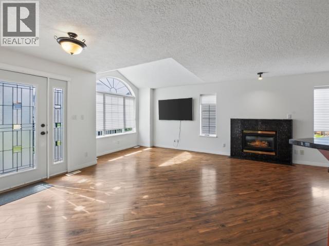 4 Ruby Lane, Whitehorse, YT - Indoor Photo Showing Living Room With Fireplace