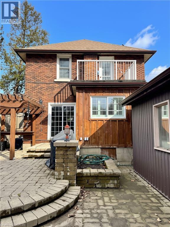 Back with patio and pergola with vines - 9 Filbert Street, Kitchener, ON - Outdoor With Deck Patio Veranda