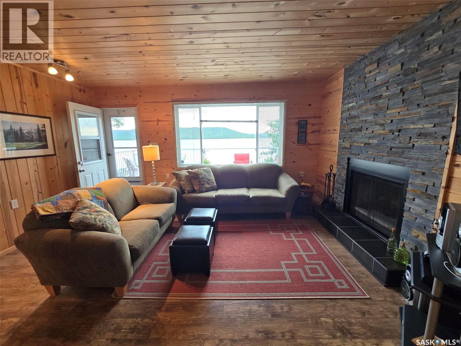 620 Surfside Drive E, Crooked Lake, SK - Indoor Photo Showing Living Room With Fireplace