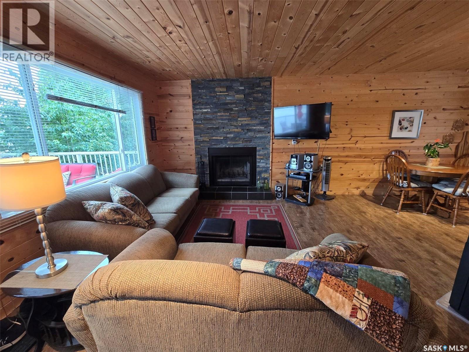 620 Surfside Drive E, Crooked Lake, SK - Indoor Photo Showing Living Room With Fireplace