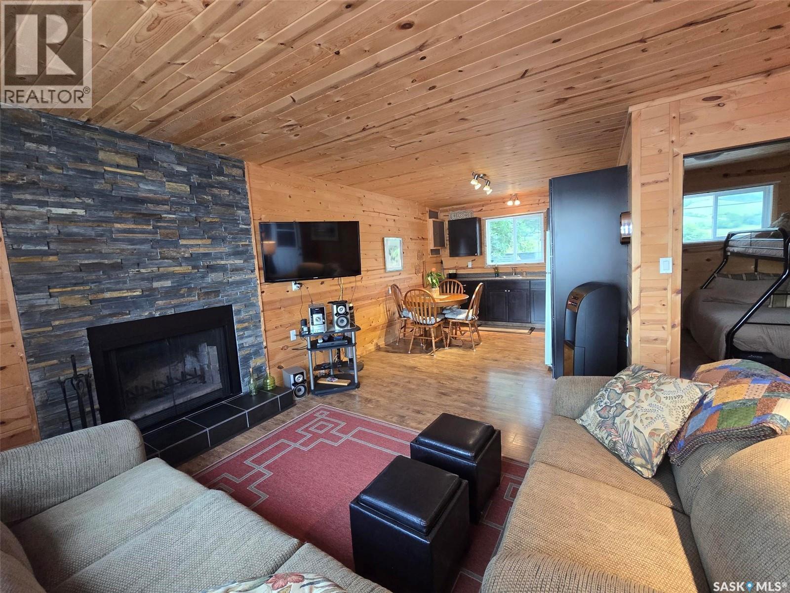 620 Surfside Drive E, Crooked Lake, SK - Indoor Photo Showing Living Room With Fireplace