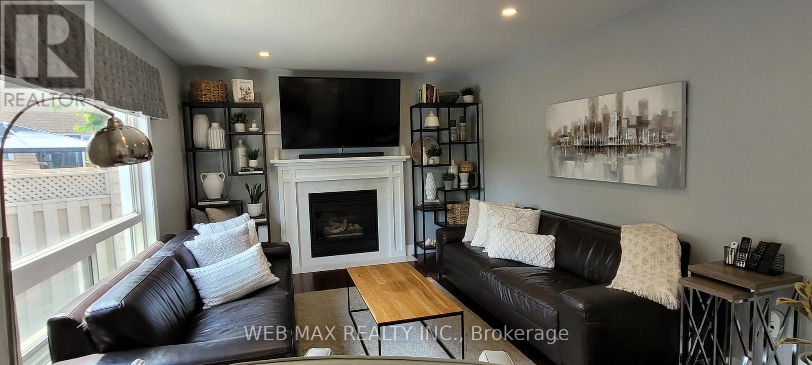 updated modern fireplace in family room - 22 Ashbury Crescent, Caledon, ON - Indoor Photo Showing Living Room With Fireplace