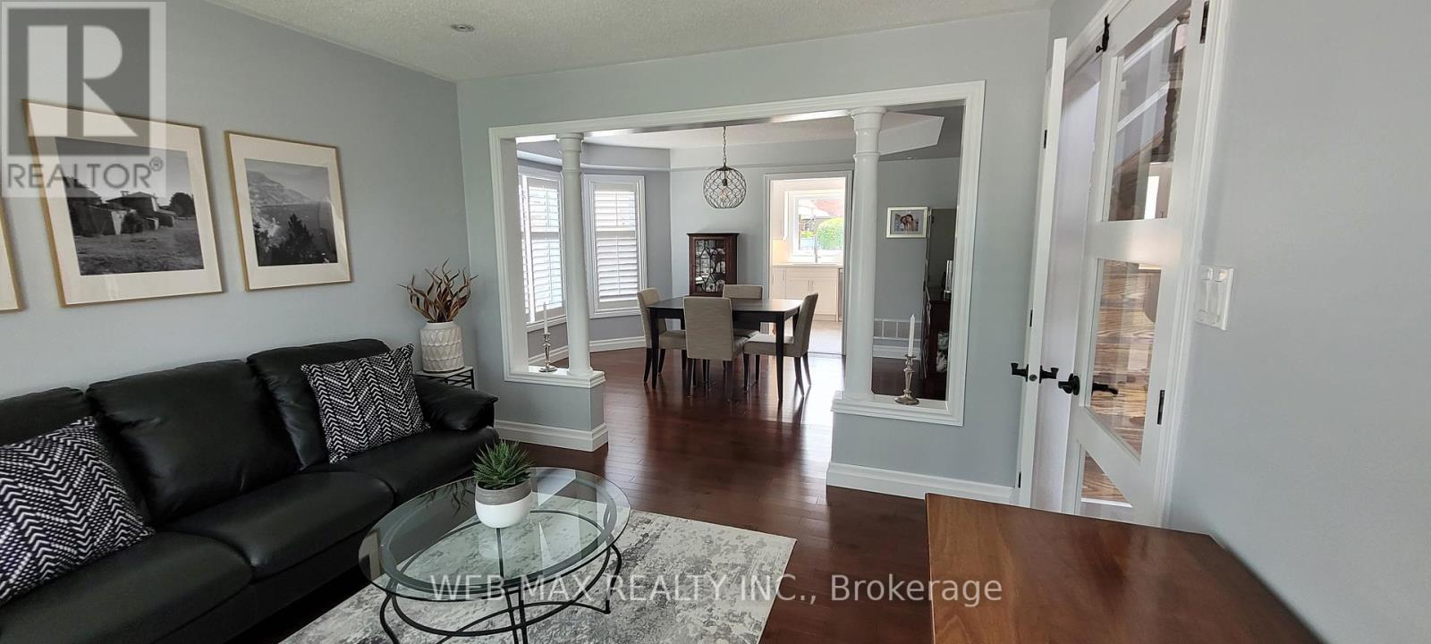bow window dining room leads to kitchen - 22 Ashbury Crescent, Caledon, ON - Indoor Photo Showing Living Room