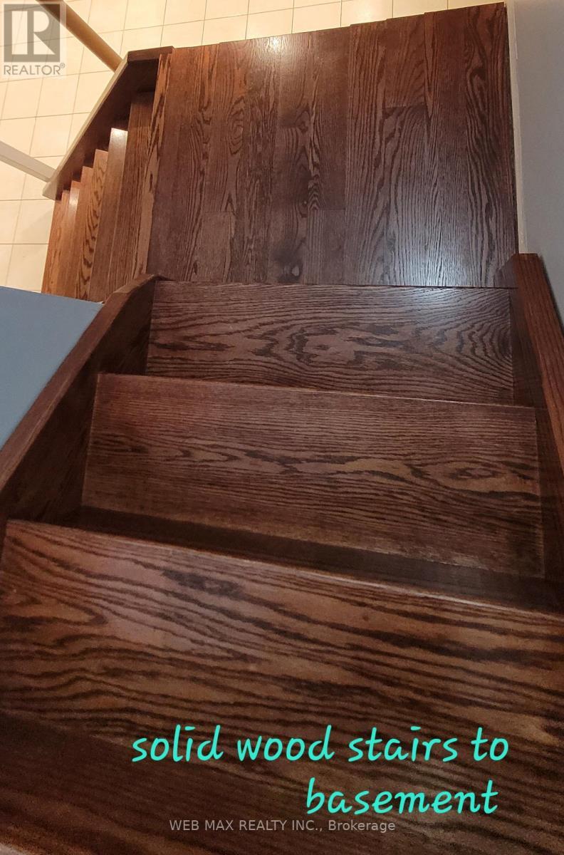 Solid wood stairs leading to basement - 22 Ashbury Crescent, Caledon, ON - Indoor Photo Showing Other Room