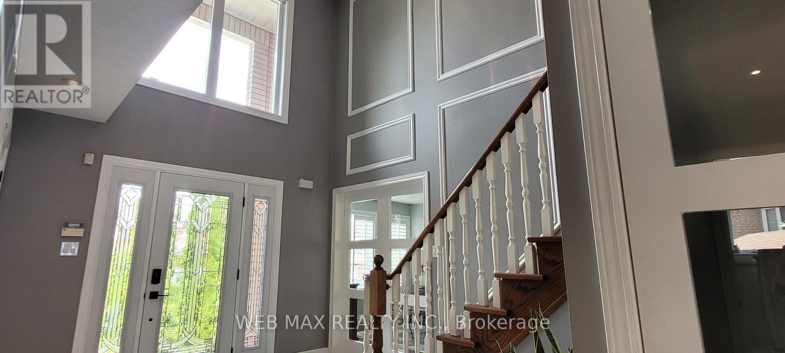 new double door entry to living room - 22 Ashbury Crescent, Caledon, ON - Indoor Photo Showing Other Room