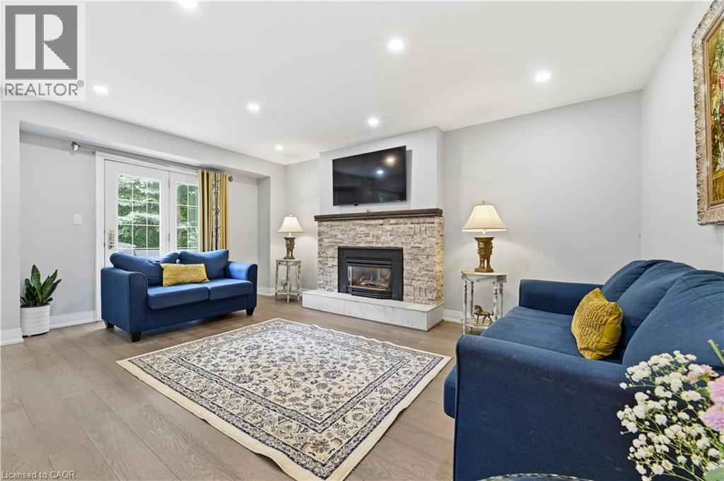 512 Hawthorne Crescent, Milton, ON - Indoor Photo Showing Living Room With Fireplace